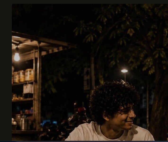 A roadside cart glowing after dark in Bangalore